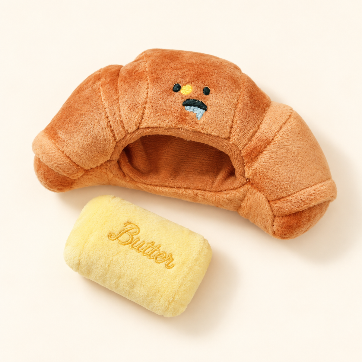 Croissant toy and removable yellow Butter insert.